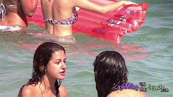 two italian girls livecam com playing under the water on the topless beach 